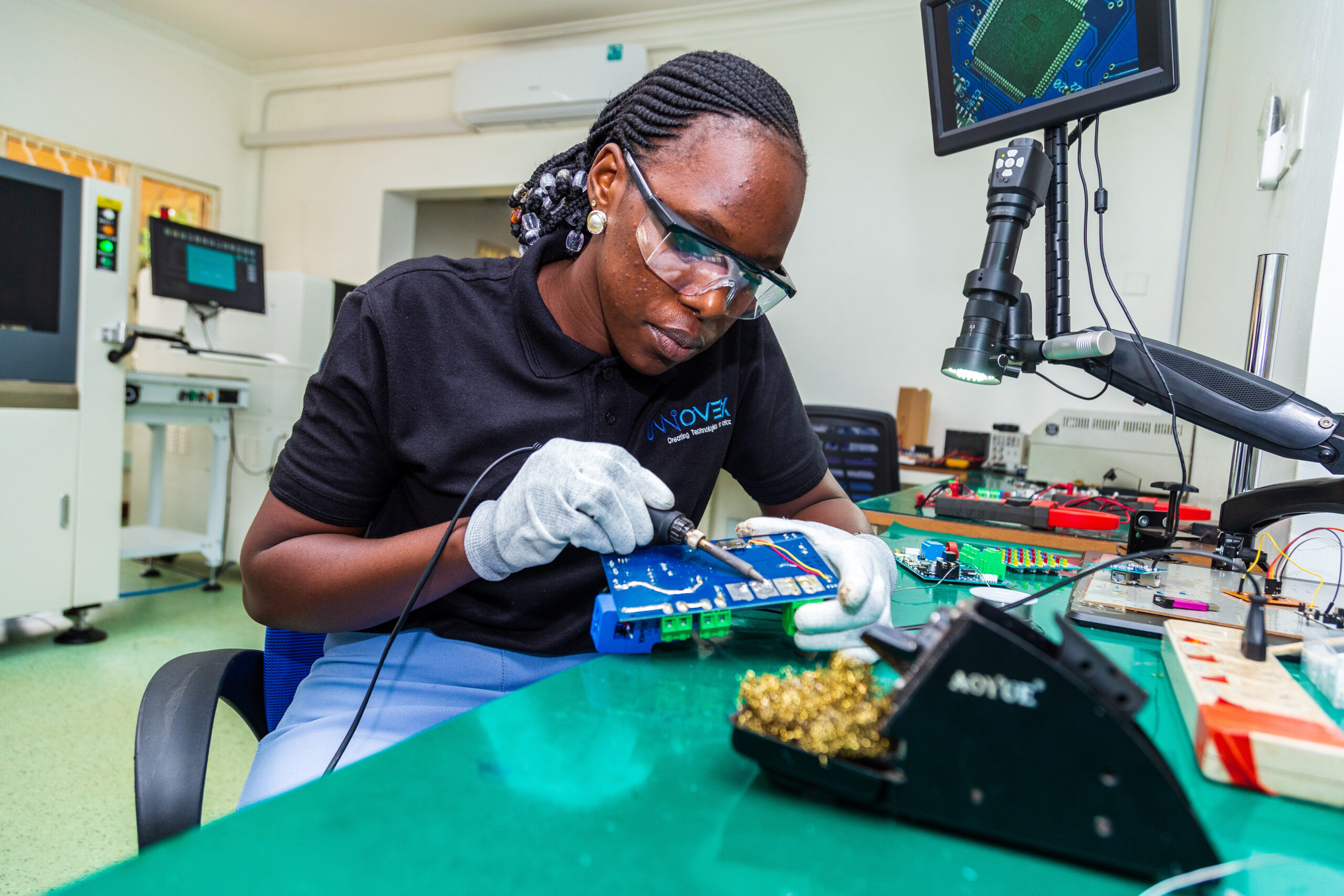 Innovex technician soldering electronic components