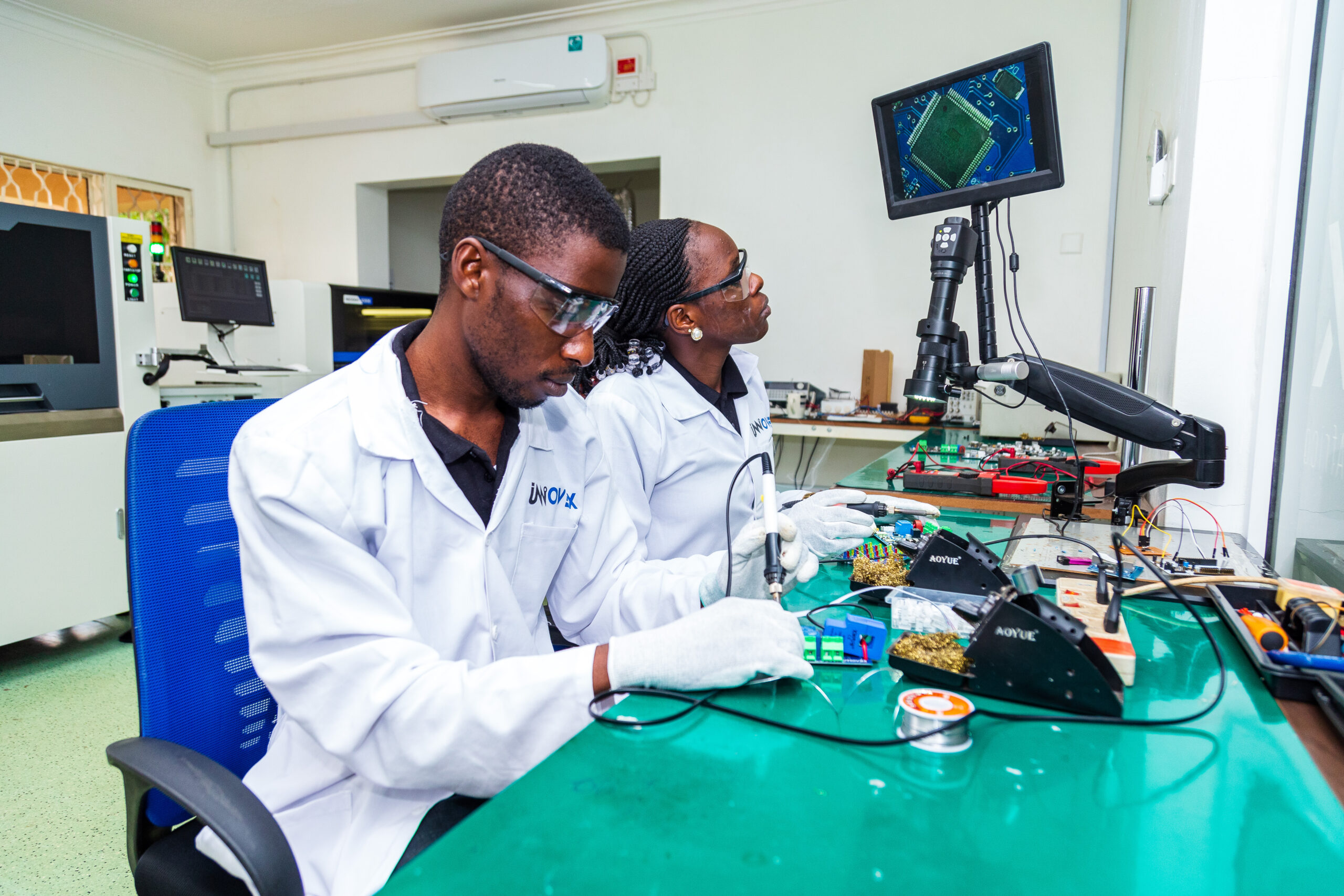 Innovex engineering team working on electronics in the lab